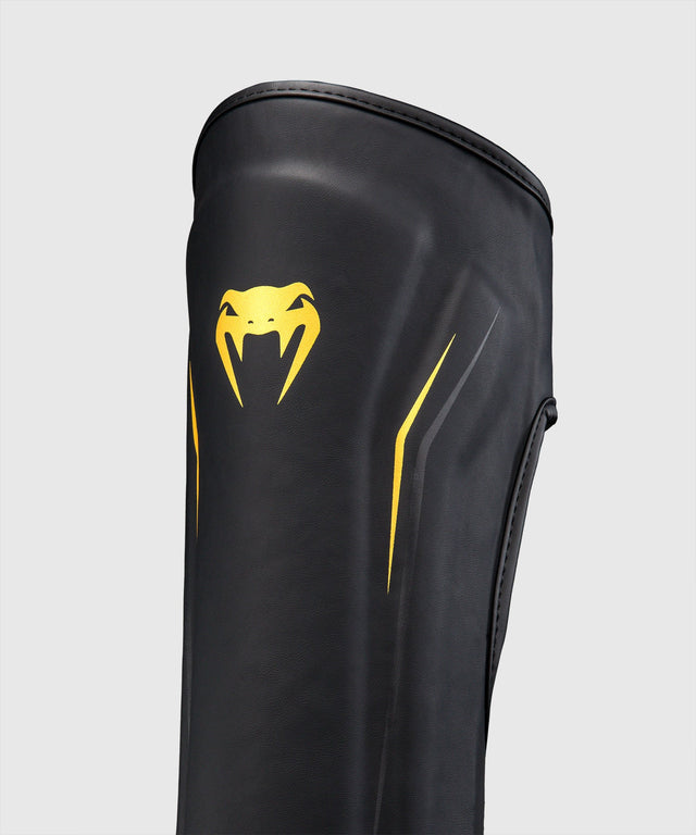 Espinilleras Venum G-Core – Negro/Oro