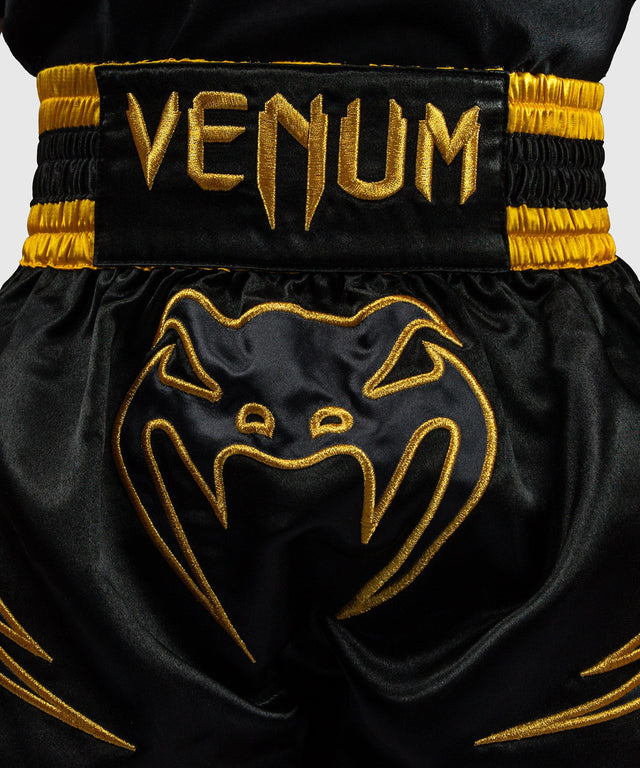 Pantaloni scurți Muay Thai Venum Bangkok Fury – Copii – Negru/Auriu