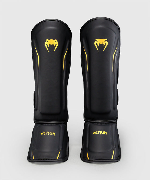 Espinilleras Venum G-Core – Negro/Oro