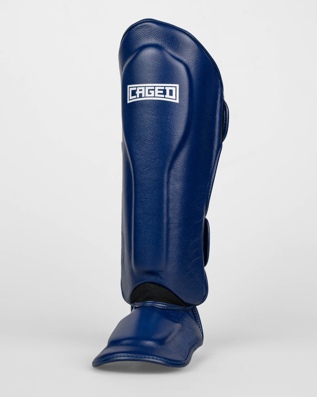 Caged Benskydd 'X' Series – Navy Blå/Vit