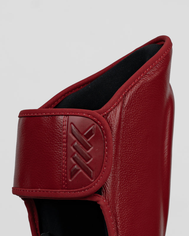 Espinilleras Caged 'X' Series - Rojo Burdeos