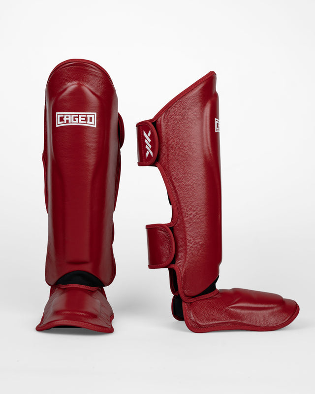 Espinilleras Caged 'X' Series – Rojo Burdeos/Blanco