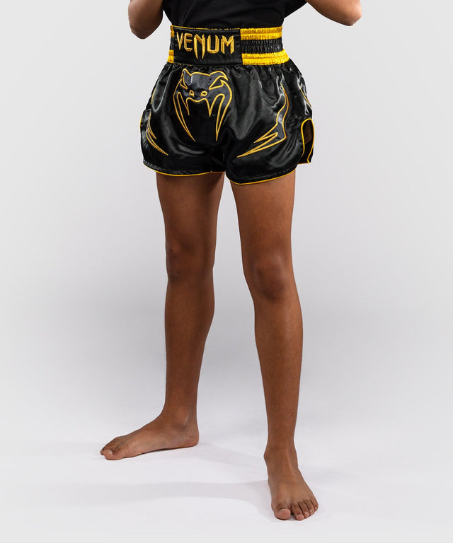 Pantaloni scurți Muay Thai Venum Bangkok Fury – Copii – Negru/Auriu