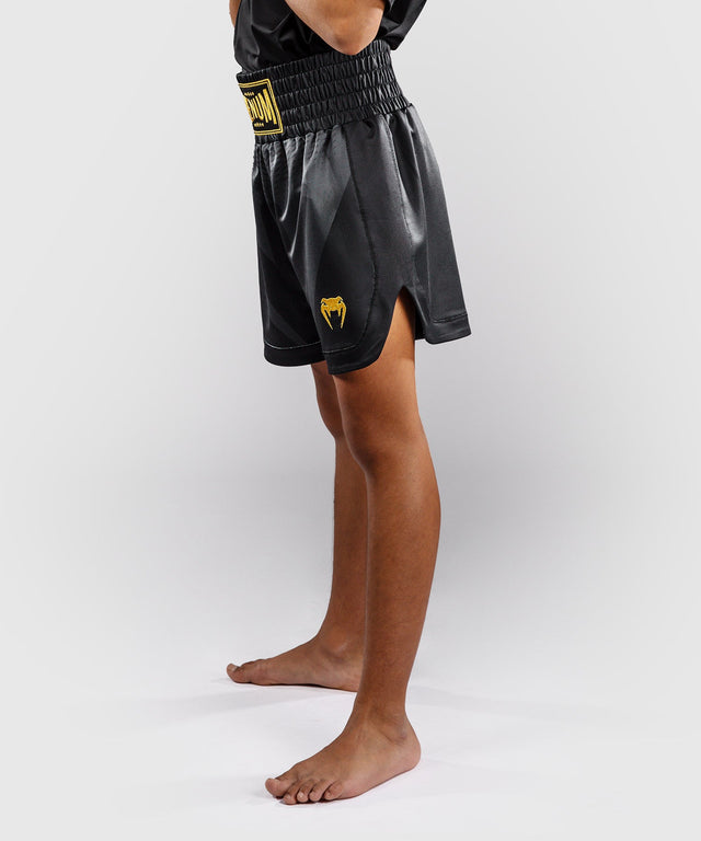 Pantaloni scurți de box Venum Attack – Negru/Aur – Copii