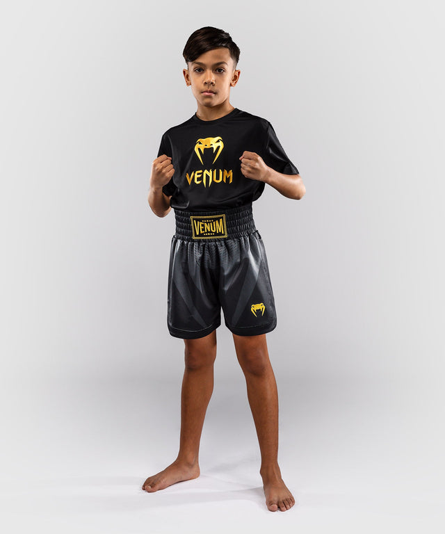 Pantaloni scurți de box Venum Attack – Negru/Aur – Copii