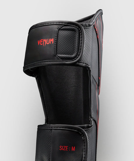 Espinilleras Venum Amazonia Reborn – Negro/Rojo