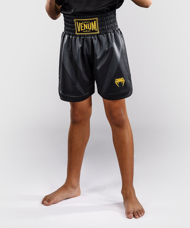 Pantaloni scurți de box Venum Attack – Negru/Aur – Copii