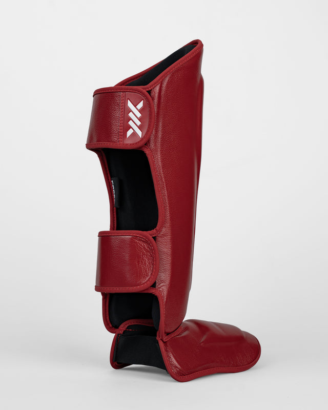 Espinilleras Caged 'X' Series – Rojo Burdeos/Blanco