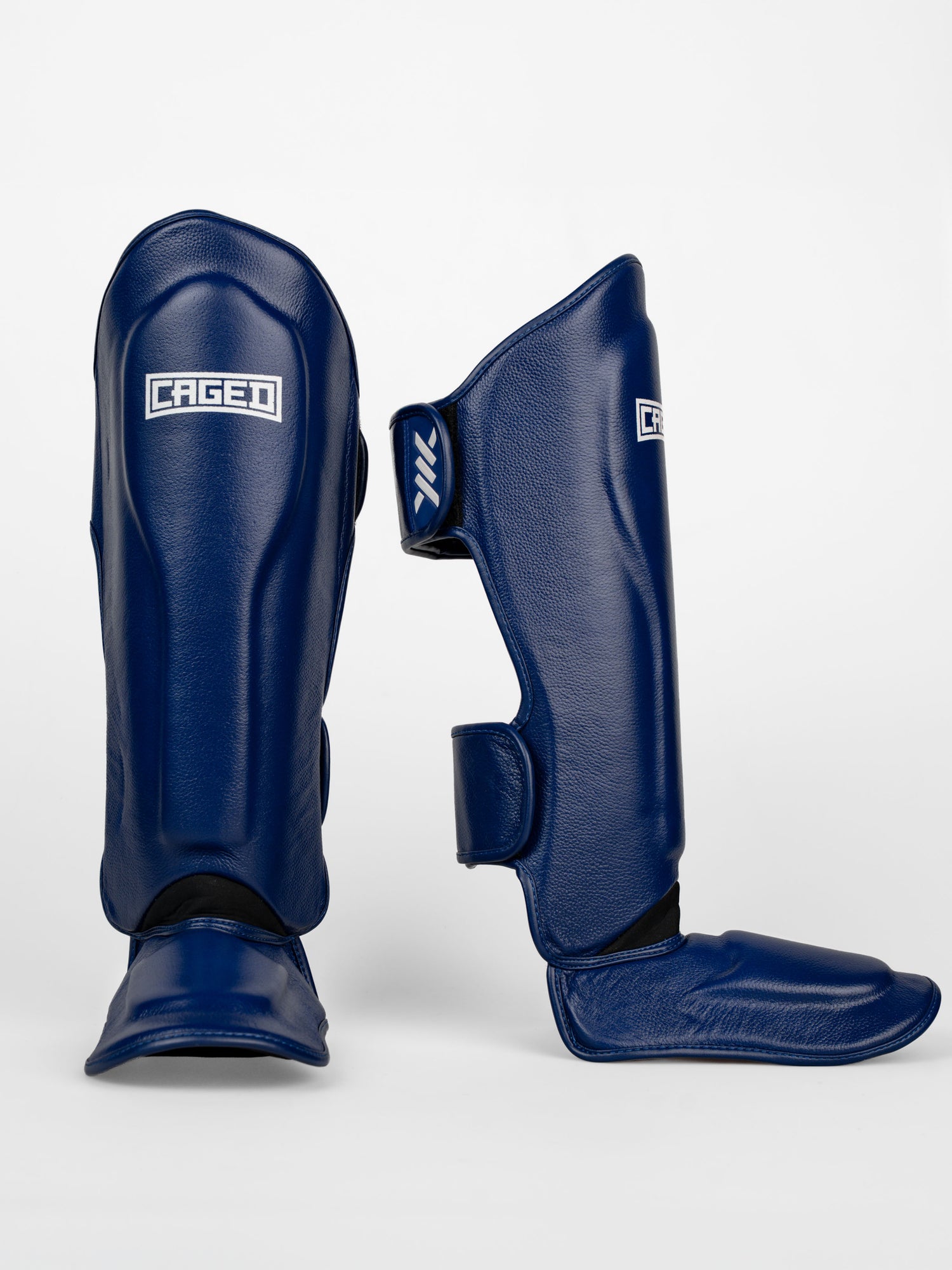 Caged Benskydd 'X' Series – Navy Blå/Vit