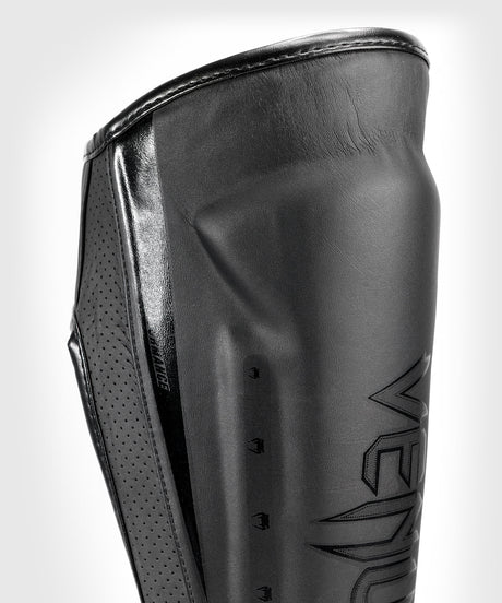 Protège-tibias Venum Elite Evo – Noir/Noir