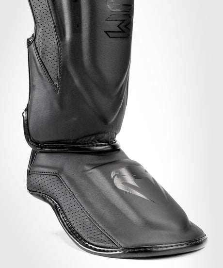Protège-tibias Venum Elite Evo – Noir/Noir