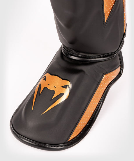 Protège-tibias Venum Elite Evo – Noir/Bronze