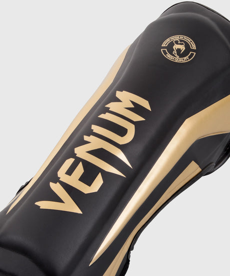 Protège-tibias Venum Elite – Noir/Or