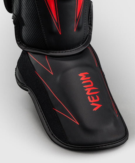 Espinilleras Venum Amazonia Reborn – Negro/Rojo