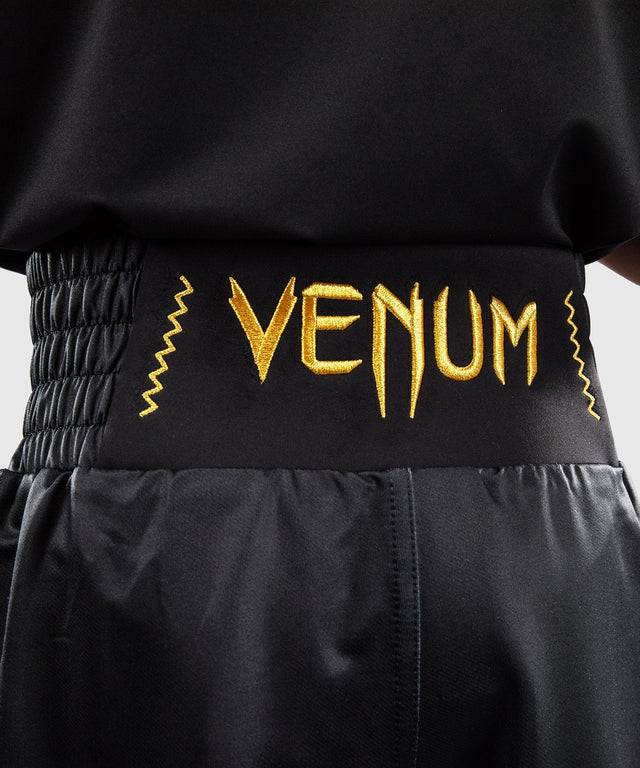 Pantaloni scurți de box Venum Attack – Negru/Aur – Copii