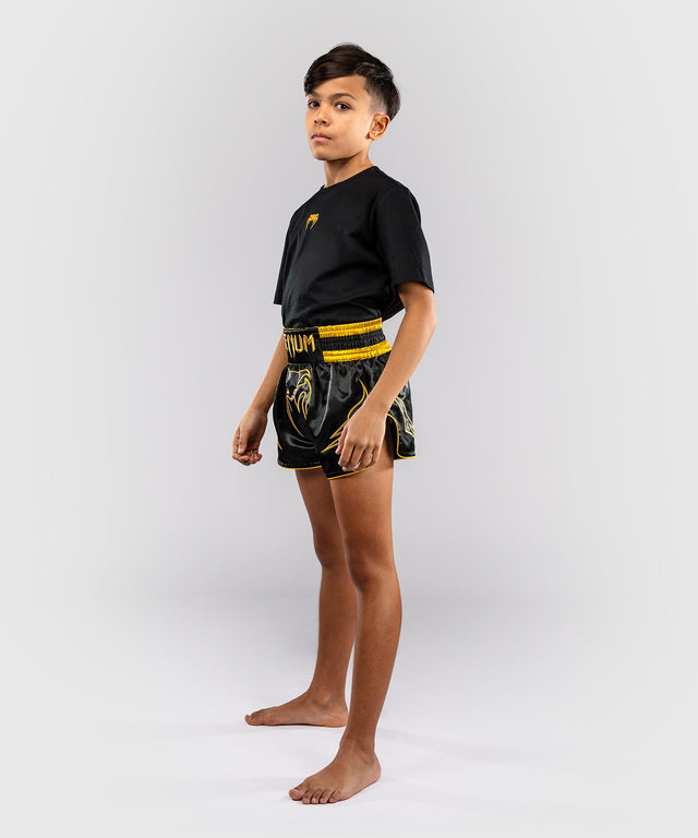 Pantaloni scurți Muay Thai Venum Bangkok Fury – Copii – Negru/Auriu