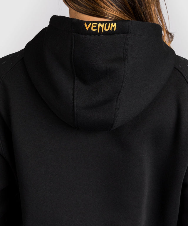 Sudadera con capucha UFC Venum Zenith para mujer – Negro/Oro