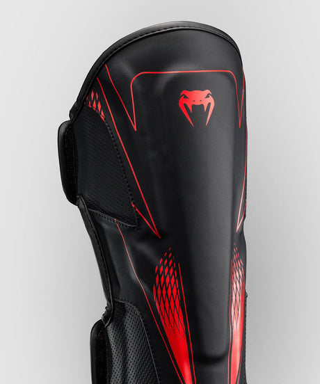 Espinilleras Venum Amazonia Reborn – Negro/Rojo