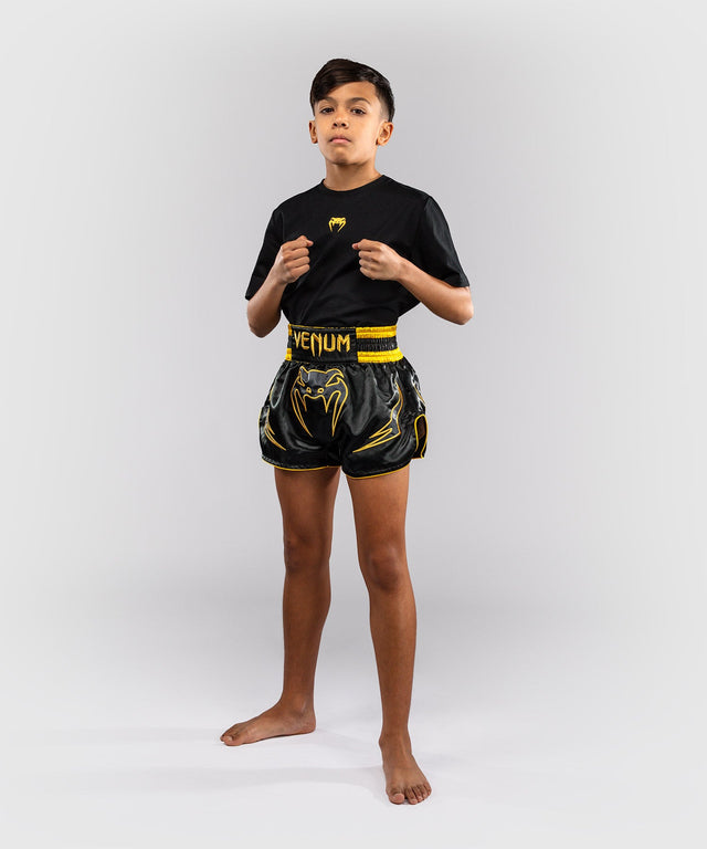 Pantaloni scurți Muay Thai Venum Bangkok Fury – Copii – Negru/Auriu