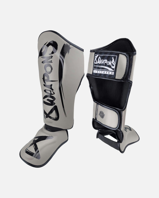 Espinilleras 8 WEAPONS Unlimited 2.0 – Arena/Negro
