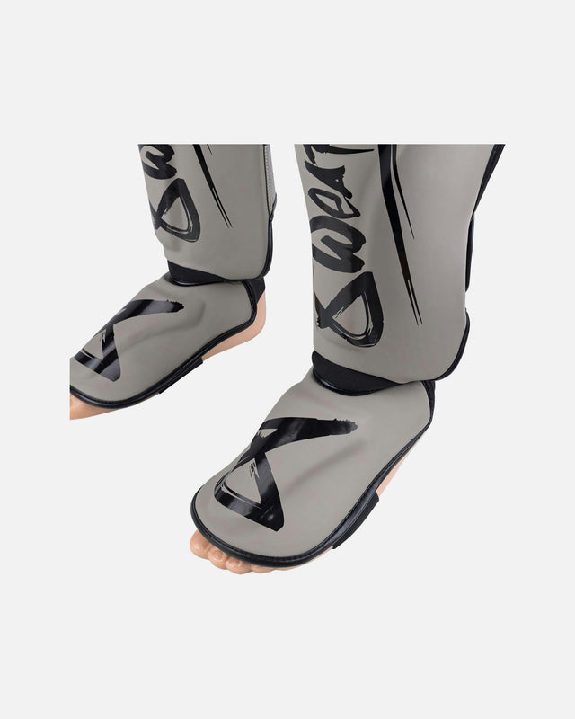 Espinilleras 8 WEAPONS Unlimited 2.0 – Arena/Negro