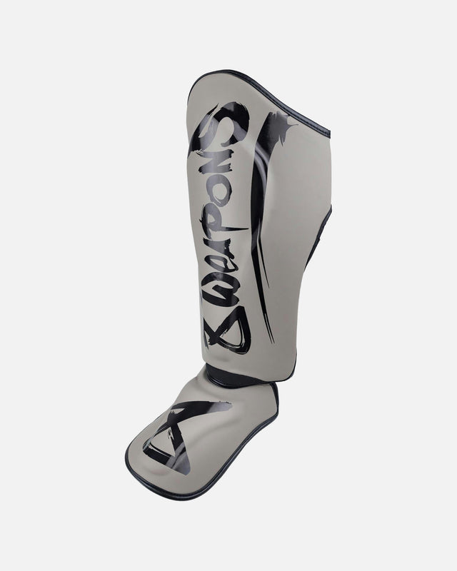 Espinilleras 8 WEAPONS Unlimited 2.0 – Arena/Negro
