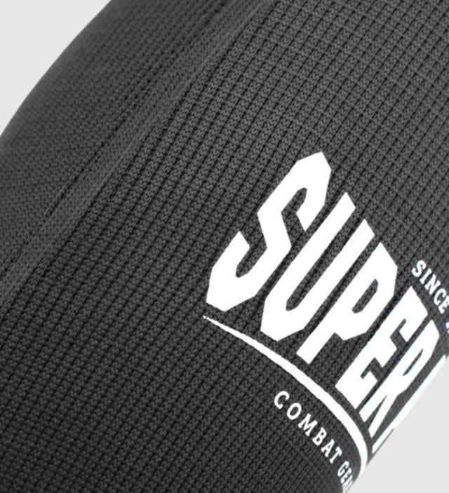 Espinillera Super Pro Defender – Negro/Blanco – Espinilleras